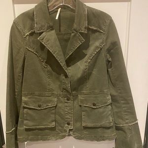 Women’s Free People Army green jacket with ruffled back and lace cuffs.